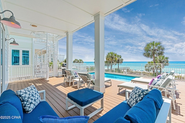 13643 Front Beach Rd, Panama City Beach, FL 32413 - wooden terrace with a community pool and a water view
