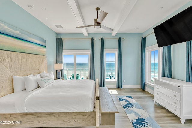 13643 Front Beach Rd, Panama City Beach, FL 32413 - bedroom with beamed ceiling, light wood-type flooring, a water view, access to outside, and a ceiling fan