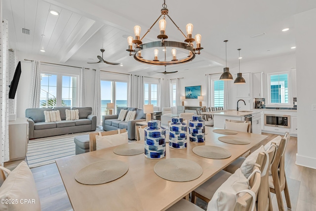 13643 Front Beach Rd, Panama City Beach, FL 32413 - dining space with light wood-type flooring, plenty of natural light, a chandelier, recessed lighting, and beam ceiling