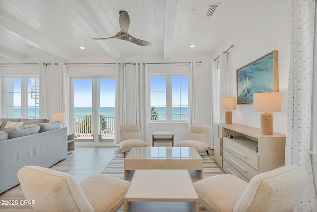 13643 Front Beach Rd, Panama City Beach, FL 32413 - living area with a water view, wood finished floors, a wooden ceiling with exposed beams, a ceiling fan, and recessed lighting