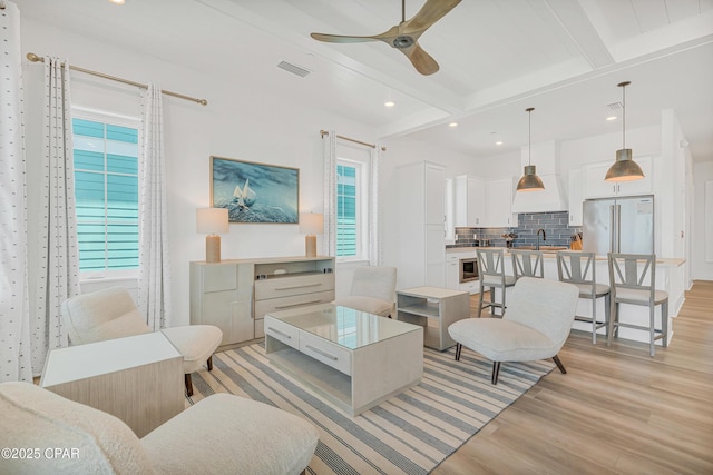 13643 Front Beach Rd, Panama City Beach, FL 32413 - living room with a ceiling fan, light wood-type flooring, beam ceiling, and recessed lighting