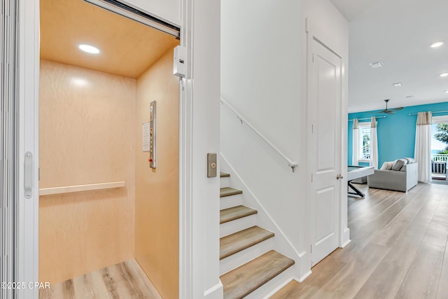 13643 Front Beach Rd, Panama City Beach, FL 32413 - staircase featuring elevator, wood finished floors, recessed lighting, and a ceiling fan