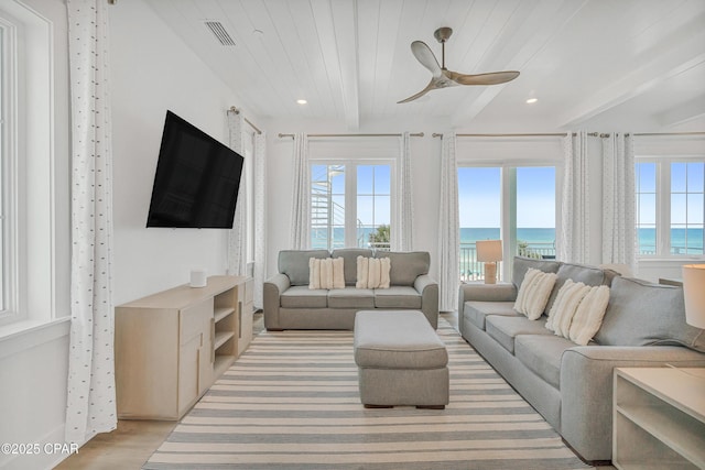 13643 Front Beach Rd, Panama City Beach, FL 32413 - living area with beam ceiling, a ceiling fan, light wood finished floors, and recessed lighting
