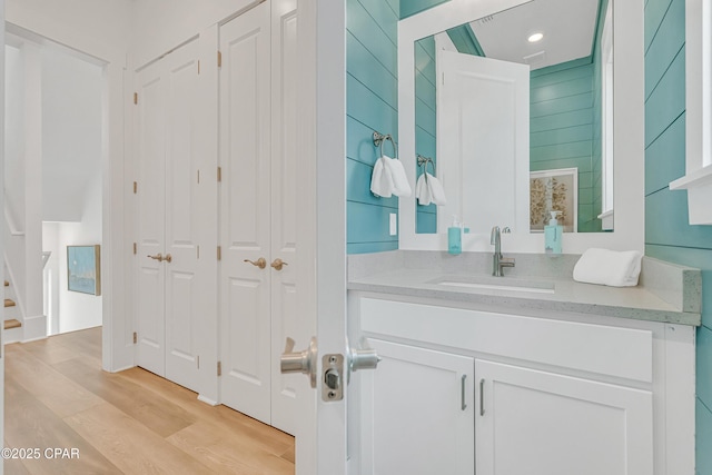 13643 Front Beach Rd, Panama City Beach, FL 32413 - bathroom featuring a closet, vanity, wood finished floors, and recessed lighting