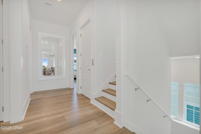 13643 Front Beach Rd, Panama City Beach, FL 32413 - hall with light wood-style floors and stairway