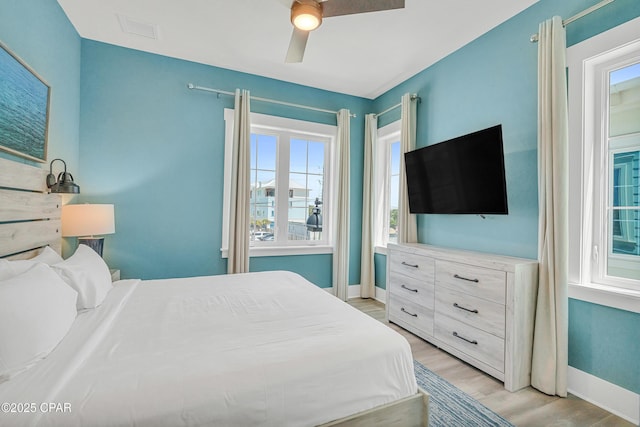 13643 Front Beach Rd, Panama City Beach, FL 32413 - bedroom with light wood-style floors and ceiling fan