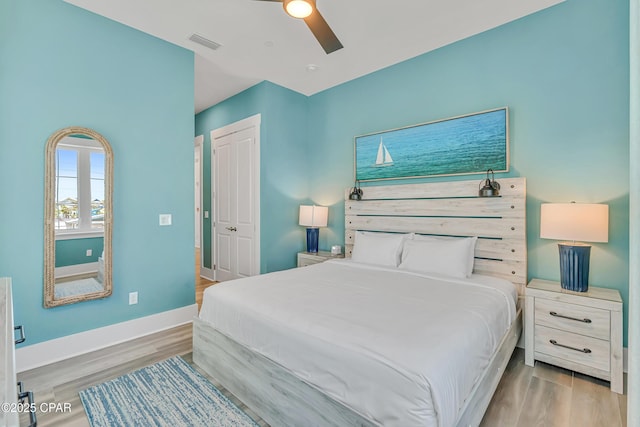 13643 Front Beach Rd, Panama City Beach, FL 32413 - bedroom featuring wood finished floors, ceiling fan, and a closet