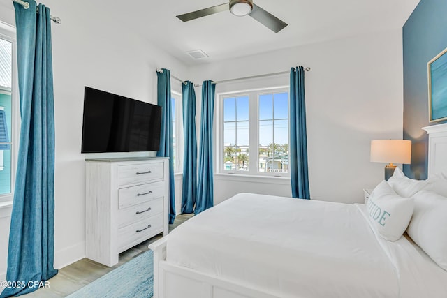 13643 Front Beach Rd, Panama City Beach, FL 32413 - bedroom featuring light wood-style floors and ceiling fan