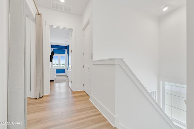 13643 Front Beach Rd, Panama City Beach, FL 32413 - hall with an upstairs landing and light wood finished floors