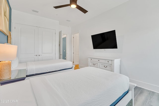 13643 Front Beach Rd, Panama City Beach, FL 32413 - bedroom with a closet, light wood-type flooring, and ceiling fan