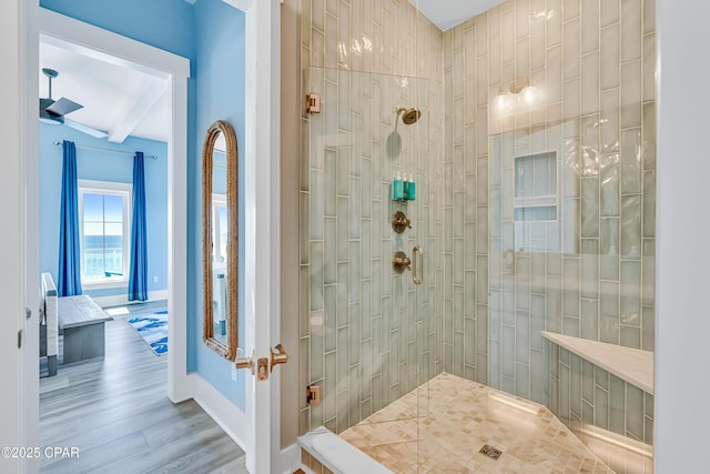13643 Front Beach Rd, Panama City Beach, FL 32413 - bathroom with tiled shower, beam ceiling, and wood finished floors