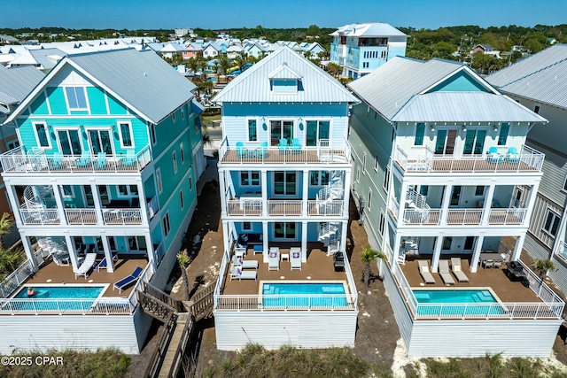 13643 Front Beach Rd, Panama City Beach, FL 32413 - back of property featuring an outdoor hangout area, a community pool, and a balcony