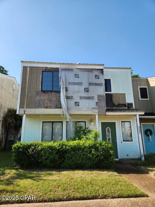 557 Palermo Rd, Panama City, FL 32405 - view of front of property featuring stucco siding and a front lawn
