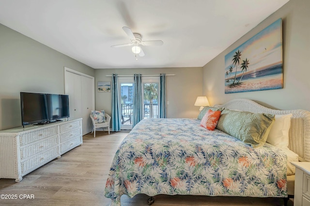 bedroom with access to outside, ceiling fan, a closet, and light wood-style floors