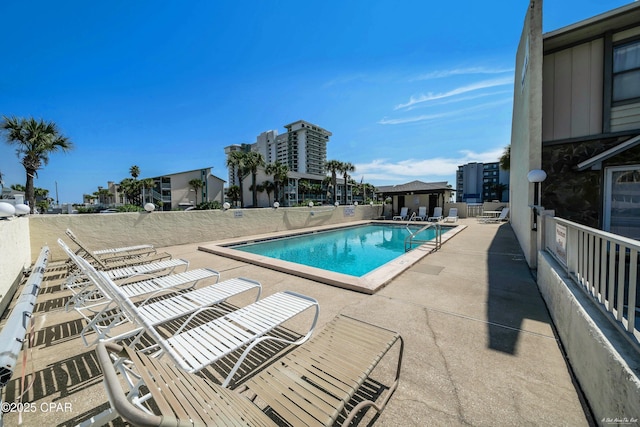 pool featuring a patio and a gazebo