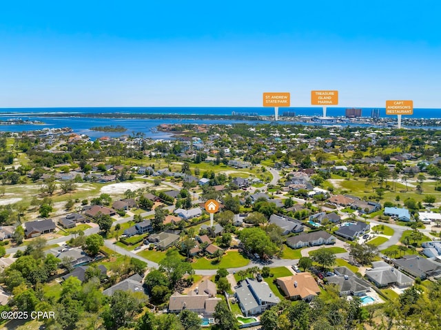 bird's eye view with a water view and a residential view