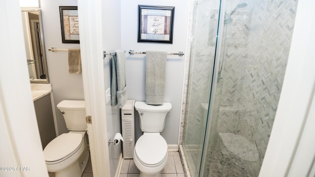 full bath featuring a stall shower, tile patterned floors, and toilet