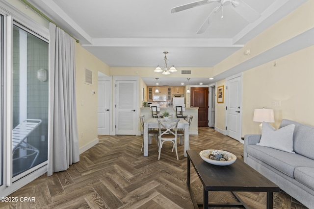 9300 Baytowne Wharf Blvd Unit 528/530, Miramar Beach, FL 32550 - living area featuring a chandelier, baseboards, and a ceiling fan