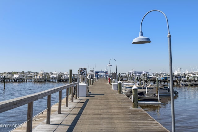 9300 Baytowne Wharf Blvd Unit 528/530, Miramar Beach, FL 32550 - dock featuring a water view, boat lift, and view of marina