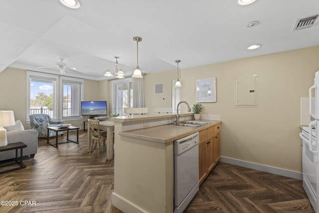 9300 Baytowne Wharf Blvd Unit 528/530, Miramar Beach, FL 32550 - kitchen featuring white appliances, a sink, a peninsula, baseboards, and electric panel