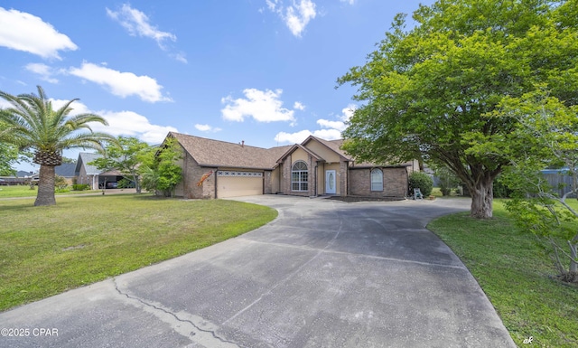 ranch-style house with a garage, driveway, a front lawn, and brick siding