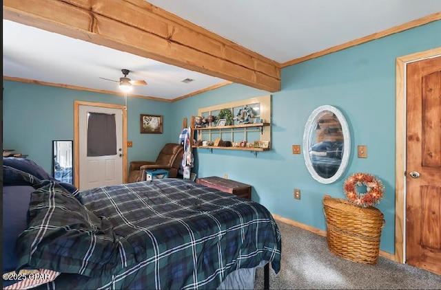 carpeted bedroom featuring visible vents, ceiling fan, and crown molding