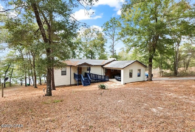 exterior space with a carport