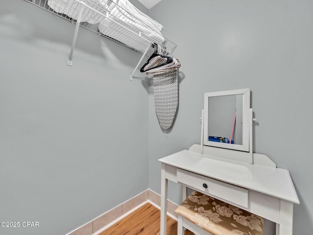 spacious closet with wood finished floors