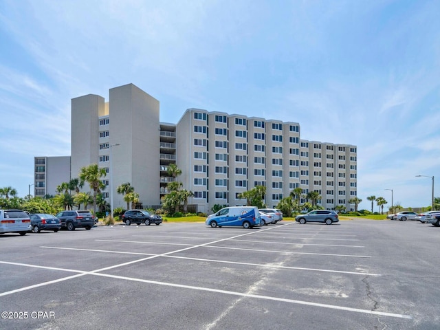 view of property featuring uncovered parking