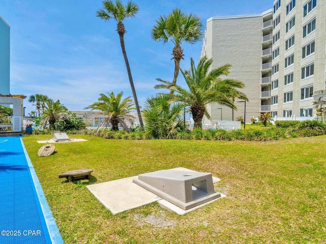 surrounding community featuring a lawn