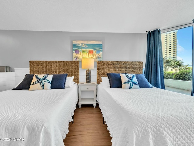 bedroom with wood finished floors