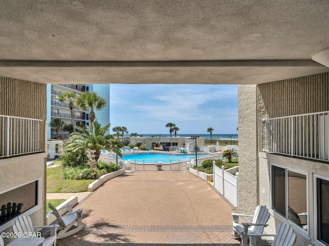 community pool featuring a patio area