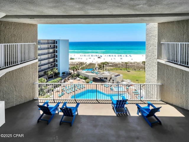 balcony with a view of the beach and a water view