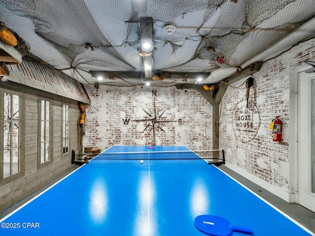 rec room with brick wall