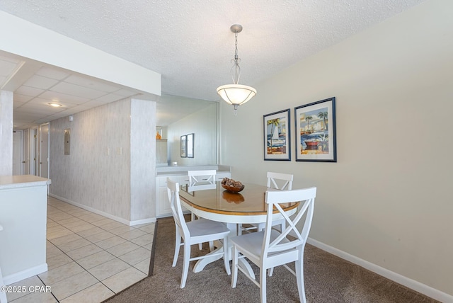 dining area featuring baseboards and light tile patterned floors