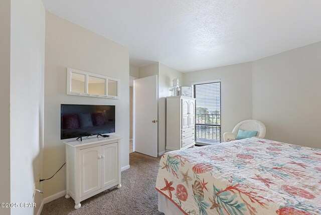 bedroom with light colored carpet and baseboards