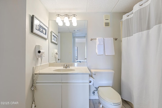 bathroom featuring toilet, vanity, and tile patterned floors
