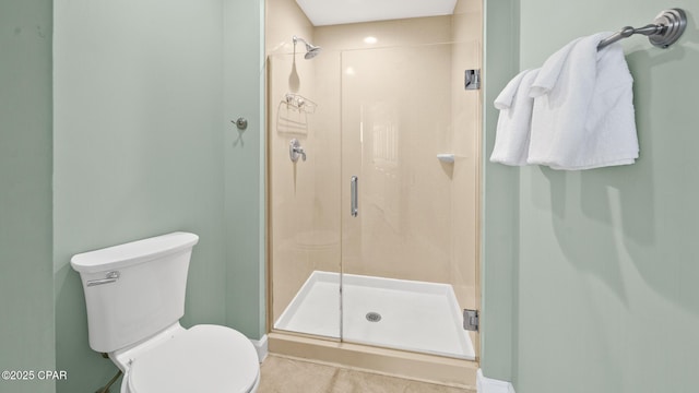 9450 S Thomas Dr Unit 1609C, Panama City Beach, FL 32408 - bathroom with a stall shower, toilet, tile patterned floors, and baseboards