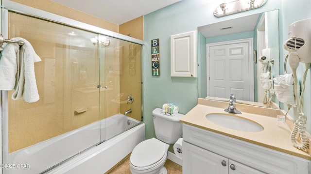 9450 S Thomas Dr Unit 1609C, Panama City Beach, FL 32408 - bathroom featuring vanity, toilet, and bath / shower combo with glass door