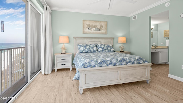 9450 S Thomas Dr Unit 1609C, Panama City Beach, FL 32408 - bedroom featuring ornamental molding, wood finished floors, a sink, access to exterior, and connected bathroom