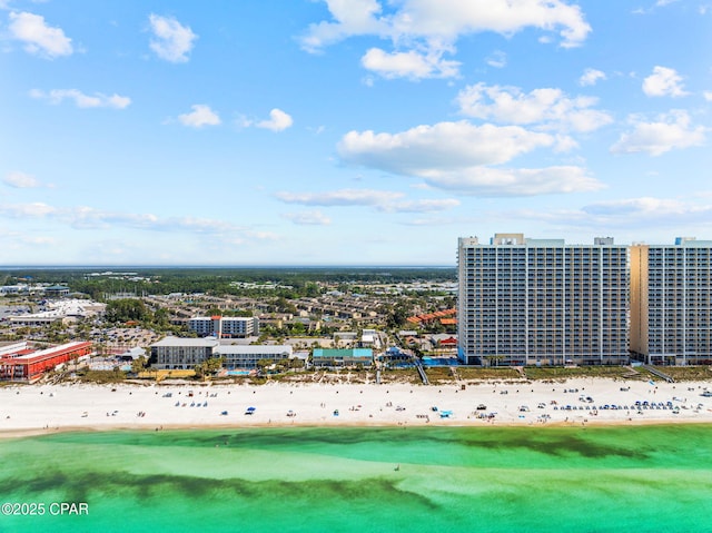 drone / aerial view with a beach view and a water view