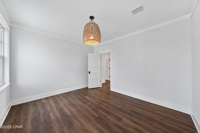 205 Mallard Ln, Santa Rosa Beach, FL 32459 - empty room with dark wood-style flooring, baseboards, visible vents, and crown molding
