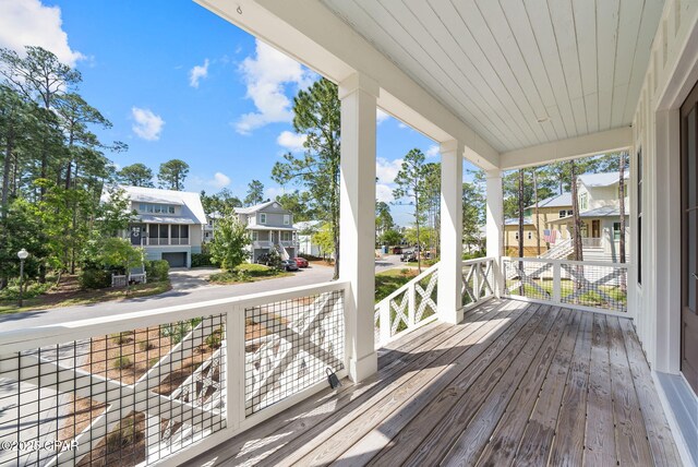 205 Mallard Ln, Santa Rosa Beach, FL 32459 - wooden terrace featuring a porch and a residential view
