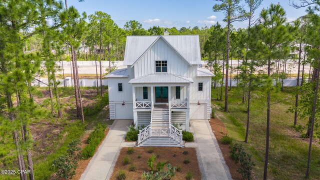 205 Mallard Ln, Santa Rosa Beach, FL 32459 - view of front of home with an attached garage, stairway, driveway, and metal roof