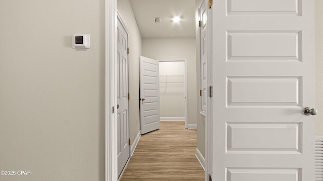 4744 Rosemary St, Panama City, FL 32404 - corridor featuring baseboards, wood finished floors, and visible vents