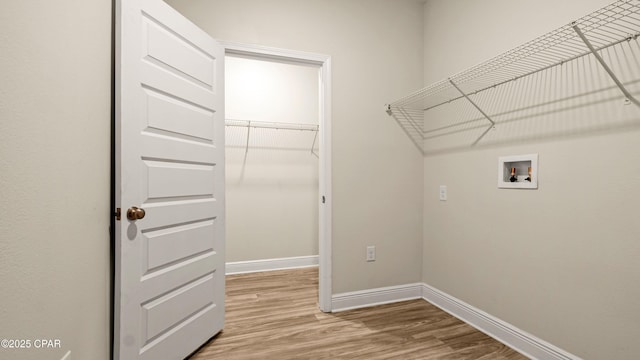 4744 Rosemary St, Panama City, FL 32404 - laundry room with light wood-style flooring, baseboards, laundry area, and washer hookup