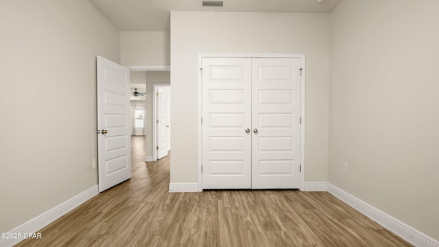 4744 Rosemary St, Panama City, FL 32404 - unfurnished bedroom featuring a closet, light wood finished floors, baseboards, and visible vents