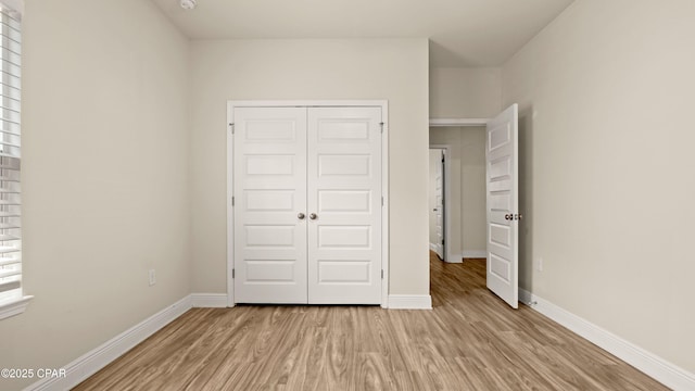 4744 Rosemary St, Panama City, FL 32404 - unfurnished bedroom featuring light wood-type flooring, baseboards, and a closet