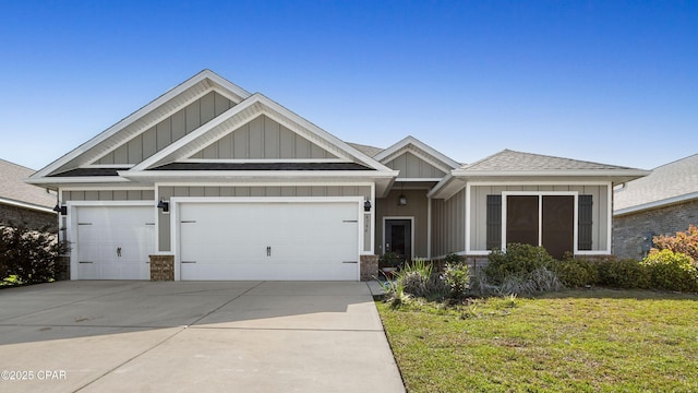 4744 Rosemary St, Panama City, FL 32404 - view of front of property with an attached garage, board and batten siding, driveway, stone siding, and a front yard