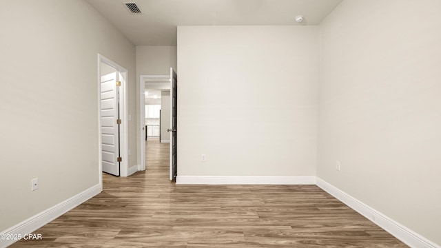 4744 Rosemary St, Panama City, FL 32404 - unfurnished room featuring wood finished floors, visible vents, and baseboards
